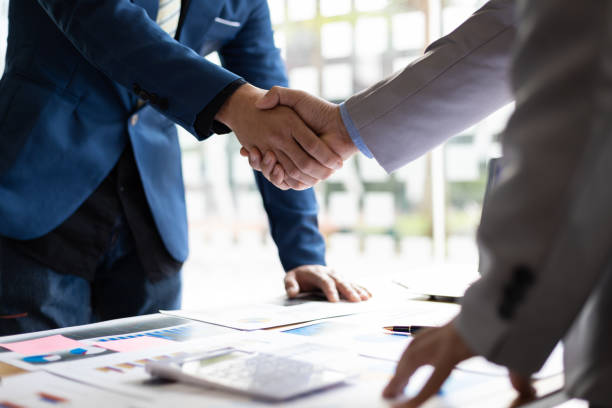 Handshake in front of a store